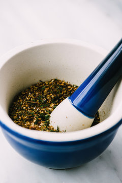 Za'atar spice grind in a mortar and pestle