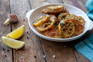 Baked zucchini and lemon. Lime. Ingridients. Garlic. Wooden. Last. Spices.