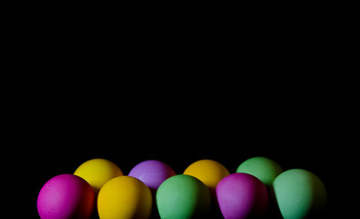 colorful eggs on a black background
