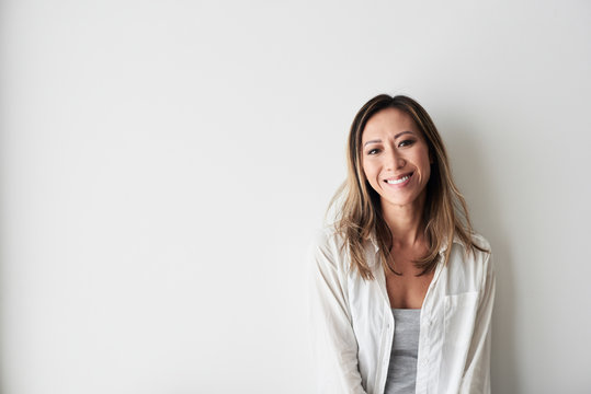 Beautiful happy woman smiling at camera.