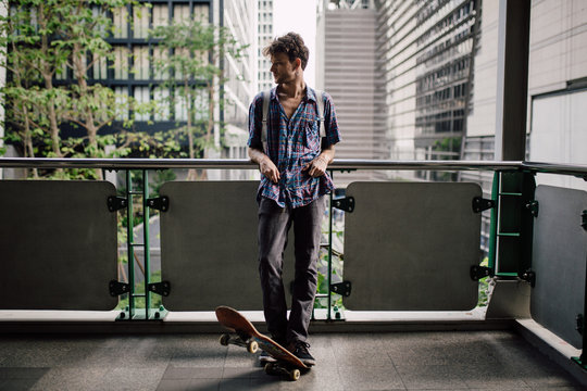 Portrait of young skater in the city