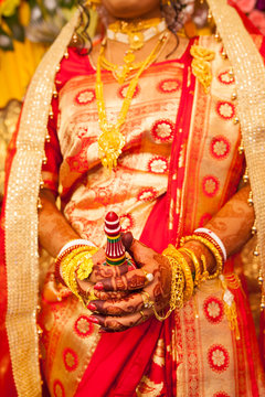 Decorative hands smudged with Mehendi  of a Hindu Bride in marriage ceremony