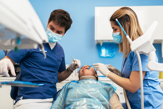Dentist during a dental intervention.