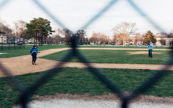 Father and son practicing pitching