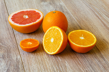 various citrus fruits on wooden table