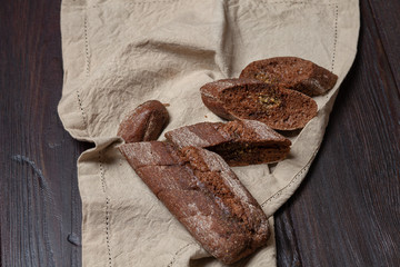 Freshly baked homemade rye bread with herbs and garlic butter. Rustic style.