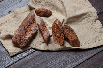 Freshly baked homemade rye bread with herbs and garlic butter. Rustic style.
