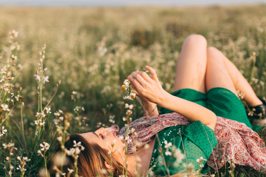 Portraits of woman celebrating spring at nature fields.