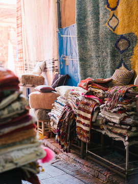 Pile of colorful rugs in shop