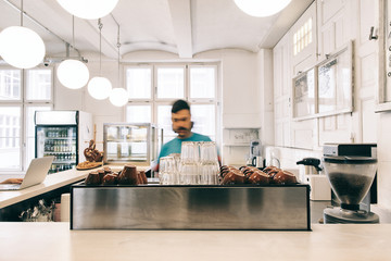 Blurred Hipster Barista at Work