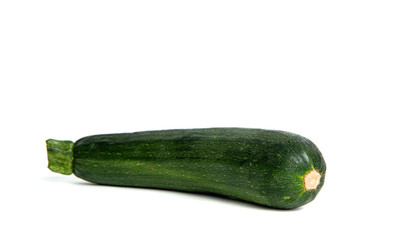 Fresh green zucchini isolated on a white background. Zucchini ready to cook. Zucchini lies on the counter, the concept of cooking and preparing a meal. Dishes for vegetarians.