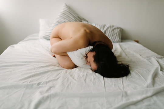 happy woman on the bed