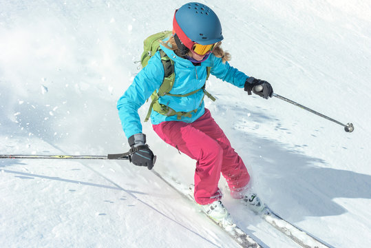 Woman skiing down the slope