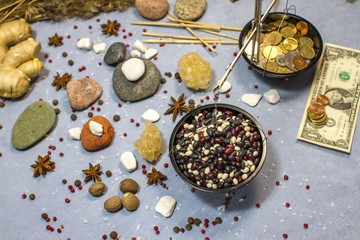 composition with scales, white beans, red beans and coins