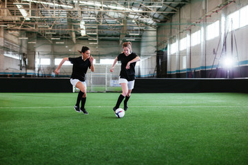 Young woman in indoor football.
