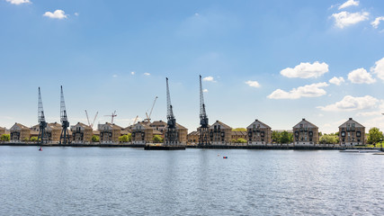 Fototapeta premium Panoramic view of houses at Royal Victoria Dock in London