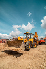 Yellow bulldozer excavator on the construction site warehouse working machine © Miljan Živković