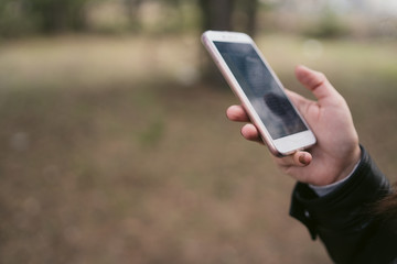Close up of woman use of mobile phone at outdoor. 