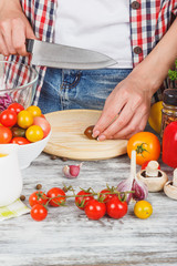 Woman cooks at the kitchen, body part, blurred background