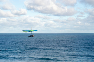 Fototapeta na wymiar Hang Glider Over Ocean