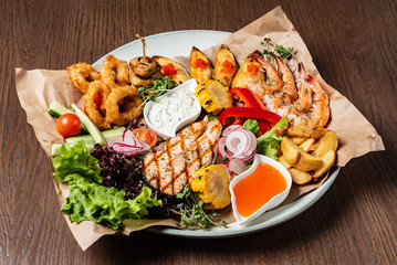 seafood plate on the wooden background