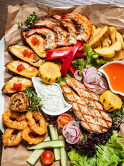seafood plate on the wooden background