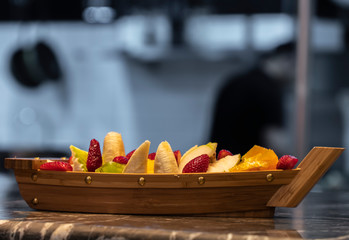 Healthy fresh fruit salad on a raft plate