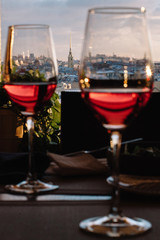 View of historical part of the city of St. Petersburg from the top through the glasses of wine.