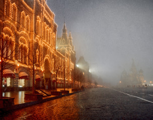 Fototapeta premium Snowy evening in Moscow. Red square and GUM