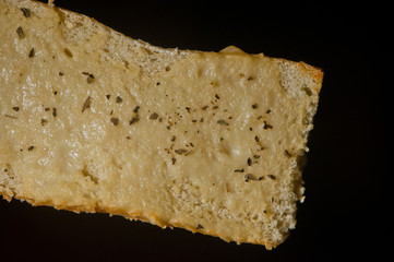 Slice of vegan oil-free garlic bread