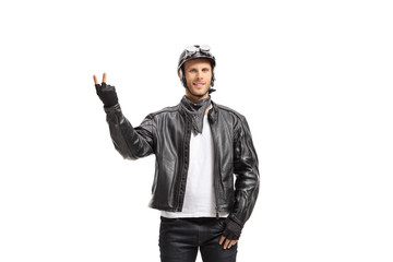 Young biker making a peace gesture
