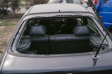 Car  after collision. A close up of a broken car after a traffic accident. Crumpled side of a car as a result of a clash. 