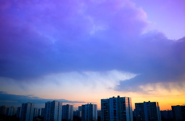 Rain clouds overcasting sunset city background hd