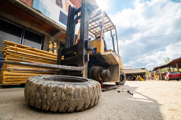 Close up on the fork lifter flat tire replacement