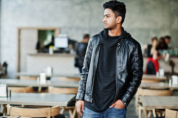 Portrait of stylish and casual young asian man wear on leather jacket spending time at cafe.