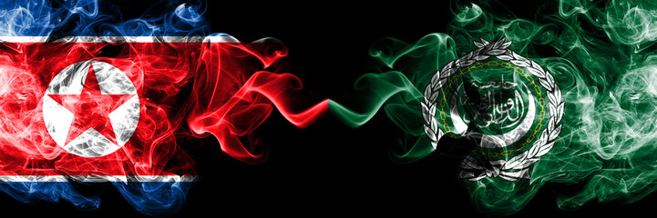 North Korea vs Arab League smoky mystic flags placed side by side. Thick colored silky smoke flags of North Korea and Arab League.