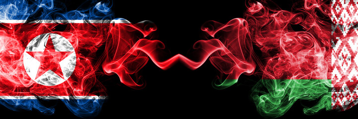 North Korea vs Belarus, Belarusian smoky mystic flags placed side by side. Thick colored silky smoke flags of North Korea and Belarus, Belarusian.