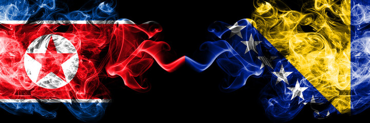 North Korea vs Bosnia and Herzegovina, Bosnian smoky mystic flags placed side by side. Thick colored silky smoke flags of North Korea and Bosnia and Herzegovina, Bosnian.