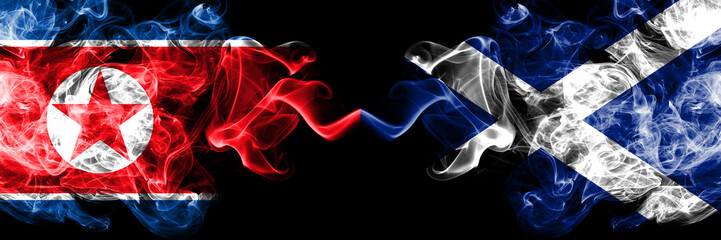 North Korea vs Scotland, Scottish smoky mystic flags placed side by side. Thick colored silky smoke flags of North Korea and Scotland, Scottish.