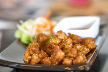 Blurred background of food (fried pork, fried chicken, french fries) served to customers and decorated with beautiful dishes for more appetizing