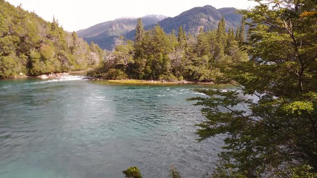 Scene view of Menendez river flowing down with a soft wind on the trees