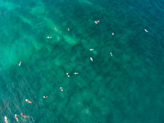 Aerial view from drone of surfers for catching waves during surfing  in the indian ocean
