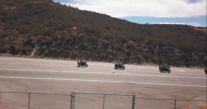Aerial drone footage, this team of Deputy Sheriffs ride down the street in formation