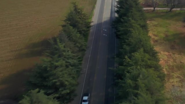 aerial drone footage flying over an open road in Solvang, Santa Ynez area.