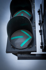 Traffic light. Green arrow sign. Turning right.