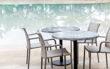 Chairs and Table with a part of swimming pool