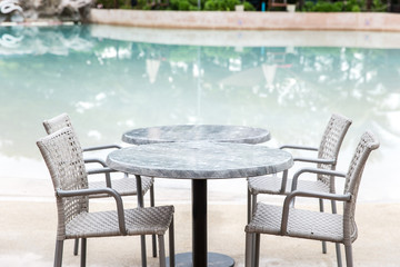 Chairs and Table with a part of swimming pool