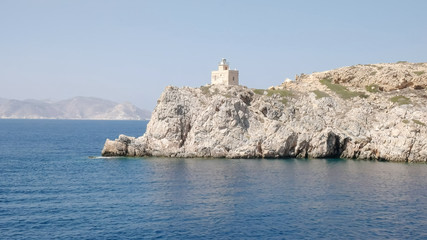 Fototapeta na wymiar lighthouse ormos harbor on the island of ios, greece