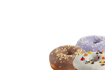 Different bright tasty donuts on a white background. Place under the text. Diversity.