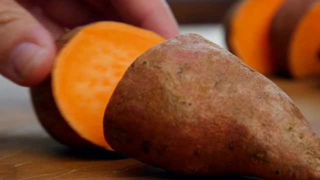 Cook slices open sweet potato.